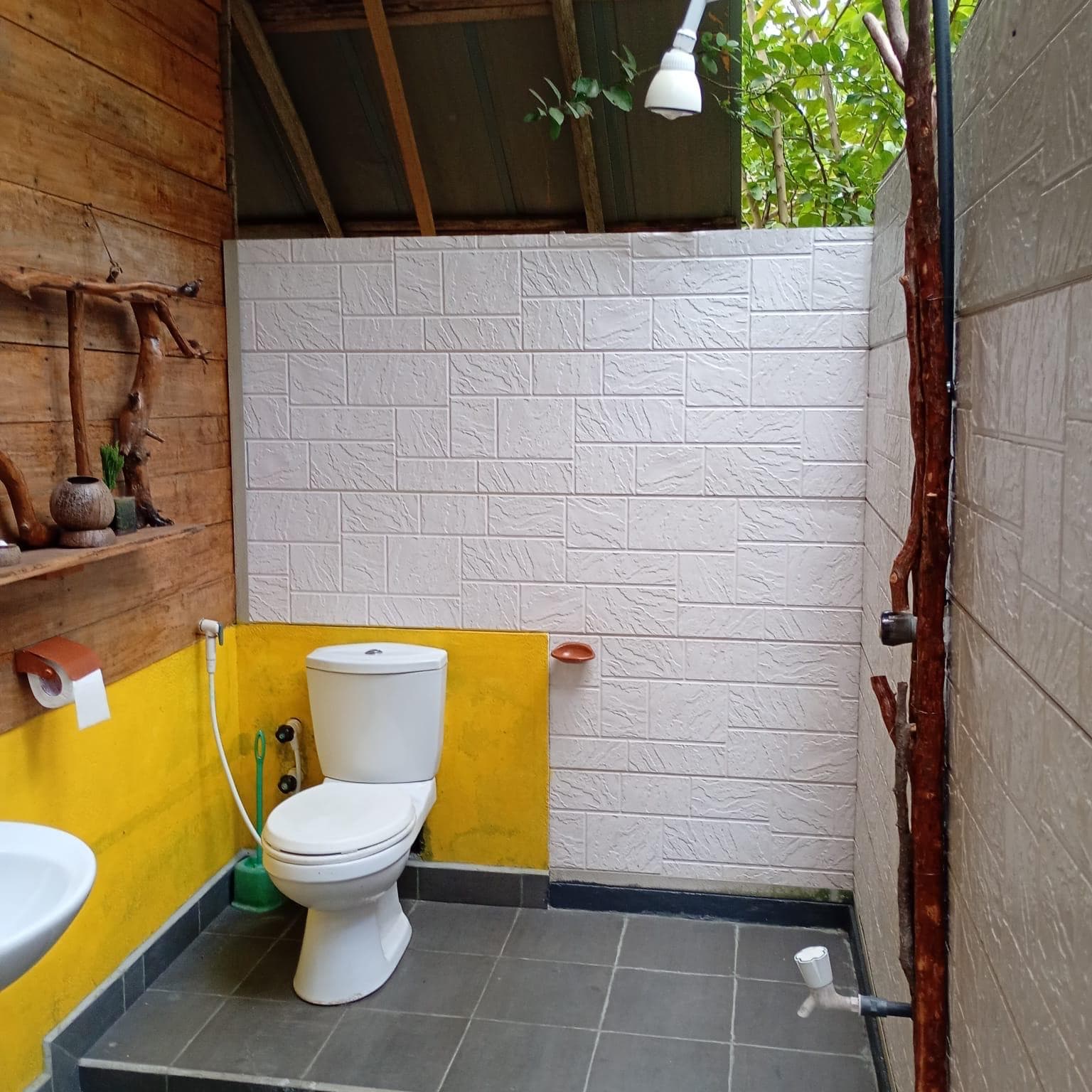 Open-air shower with trees overhead